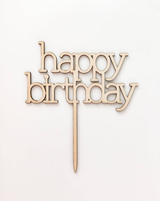 Wooden "happy birthday" topper with an elegant font, featuring a simple, natural finish on a light background.