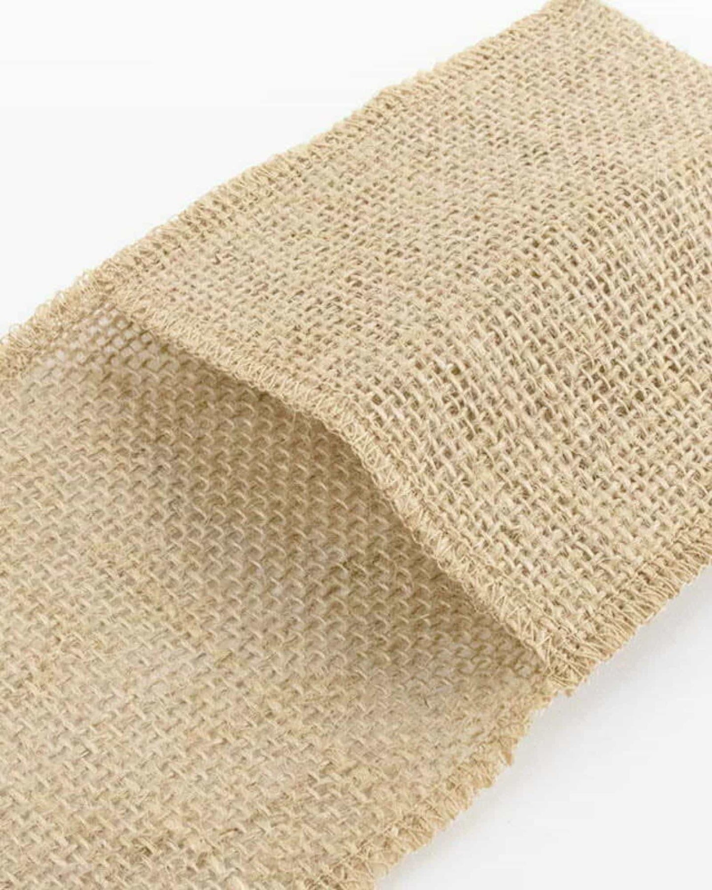 Natural burlap fabric with a rough weave, folded to display its texture and earthy color.